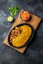 COLOMBIAN CARIBBEAN CENTRAL AMERICAN FOOD. Patacon or toston, fried and flattened whole green plantain banana on white Royalty Free Stock Photo