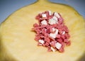 Preparation of a Colombian empanada with cheese and ham
