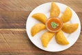 Colombian empanada with spicy sauce