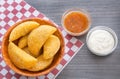 Colombian empanada with spicy sauce