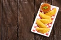 Colombian empanada with spicy sauce