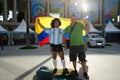 Colombian fan with a man dressed like Maradona