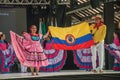 Colombian folk dancers with their national flag