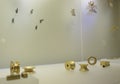 Colombian golden museum showcase with golden earrings and ear expansions Royalty Free Stock Photo