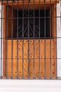Colombian house closeup, locked behind the bars` balcony door