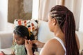 Colombian House. Family and Love. mom combs her daughter's hair
