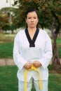 Colombian, Latin American woman practicing taekwondo in starting position