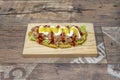 Colombian patacon with fried crushed banana, shredded chicken meat, ketchup, cream cheese and lettuce Royalty Free Stock Photo