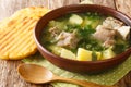 Colombian soup Caldo de costilla made from beef ribs with potatoes close-up in a bowl. horizontal Royalty Free Stock Photo