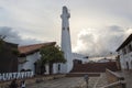 Colombian town main square with `i love guatavita` lettering main church and clock tower