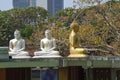 Three seated Buddha sculptures on the Seema Malakaya meditation center. Colombo