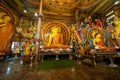 Colombo, Sri Lanka - November 19, 2019: Interior of Gangaramaya Buddhist Temple with large Buddha statue and shrine