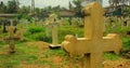 Colombo, Sri Lanka- 01 October 2018: Sri Lankan cemetery with a cross gravestone