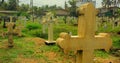 Colombo, Sri Lanka- 01 October 2018: Sri Lankan cemetery with a cross gravestone