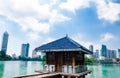 Colombo/Srilanka December 2019: VIew of Gangaramaya lake temple in Colombo Srilanka. City skyscrapersc can be seen behind