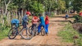 Five little guys from Paraguay with their bicycles on one of the typical paraguayan sandy paths.