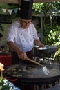 COLONIA, URUGUAY - APRIL 19, 2015: Traditional Chef cooking squi