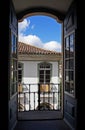 Colonial balcony door with view of Ouro Preto, Brazil Royalty Free Stock Photo