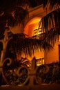 Colonial building with veranda and palm tree at night in Tel Aviv Royalty Free Stock Photo