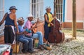 Colonial Caribbean town Street artist musician band with classic music and building in Trinidad, Cuba, America.