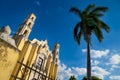 Colonial church `San Juan Bautista` with palm tree in the historic center of Merida, Yucatan, Mexico Royalty Free Stock Photo