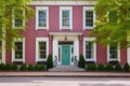 a colonial-era house with symmetrical windows and a central entrance