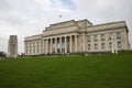 Neo-classical stone Memorial War Museum with main entry and historic WW1 and WW2 cenotaph in Auckland Domain, New Zealand