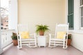 colonial front porch with rocking chairs