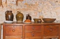 Colonial red clay, pottery, judges, bowls, and plates with fresh baked bread