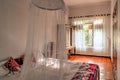 Colonial style bedroom with mosquito net