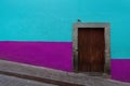 Colonial style wooden Door with colorful walls in Guanajuato Mexico. Royalty Free Stock Photo