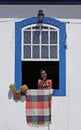 Colonial window with handicrafts, painted ceramic sculpture, called Namoradeira, sweethearts, Ouro Preto, Brazil