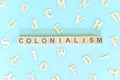 Colonialism government, politics and history concept. Wooden blocks typography flat lay