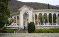 Colonnade in antique style on the background of mountains in the city of Gagra, Abkhazia, in winter