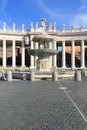 Colonnade and fountain on St.Peter`s Square in front of Saint Peter`s Basilica. Deserted square due to the Covid-19 coronovirus Royalty Free Stock Photo