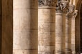 Colonnade - old rough stone corinthian columns, with decorative tops Royalty Free Stock Photo