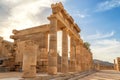 Colonnade with portico main temple of Lindos Rhodes on the background of sunset clouds and the sun Royalty Free Stock Photo