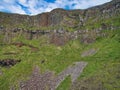 Colonnades of columnar jointing in basalt with fallen scree below at Giant`s Causeway on the Antrim Coast of Northern Ireland, UK Royalty Free Stock Photo