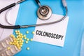 Colonoscopy word written on medical blue folder Royalty Free Stock Photo