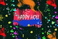 Color background of paint splashes. Logo design for Happy Holi . Colorful paint drops ink splashes. Icon, Symbol. Royalty Free Stock Photo