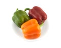 Color beel peppers on plate isolated close up Royalty Free Stock Photo