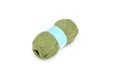 Color bobbin of yarn with label. Side view. Textile reel on isolated white background