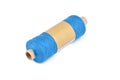 Color bobbin of yarn with label. Side view. Textile reel on isolated white background
