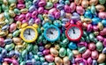 Color Chocolate Easter eggs and three alarm clocks