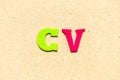 Color cloth letter in word CV Abbreviation of curriculum vitaeon wood background