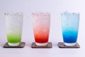 Color cocktail with ice in glasses