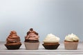 Tasty Colorful cupcakes on wooden table Royalty Free Stock Photo