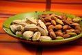 color contrast image of pistachios on an orange plate