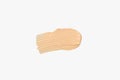 Color corrector strokes isolated on white background. Beige colour correcting cream concealer smudge smear swatch sample. Makeup Royalty Free Stock Photo