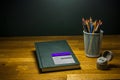 Color crayons pencils sharpener and sketchbook for art students on the table Royalty Free Stock Photo